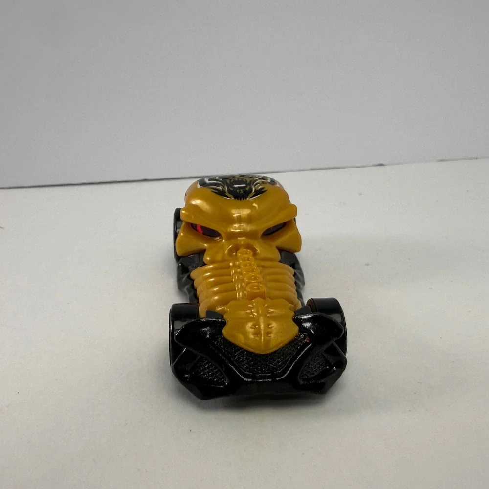 Hot Wheels Skull Crusher 2009 Mattel Gold Black Skeleton Diecast Car 1:64 Scale